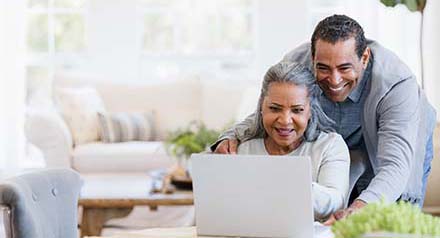 Couple using a laptop